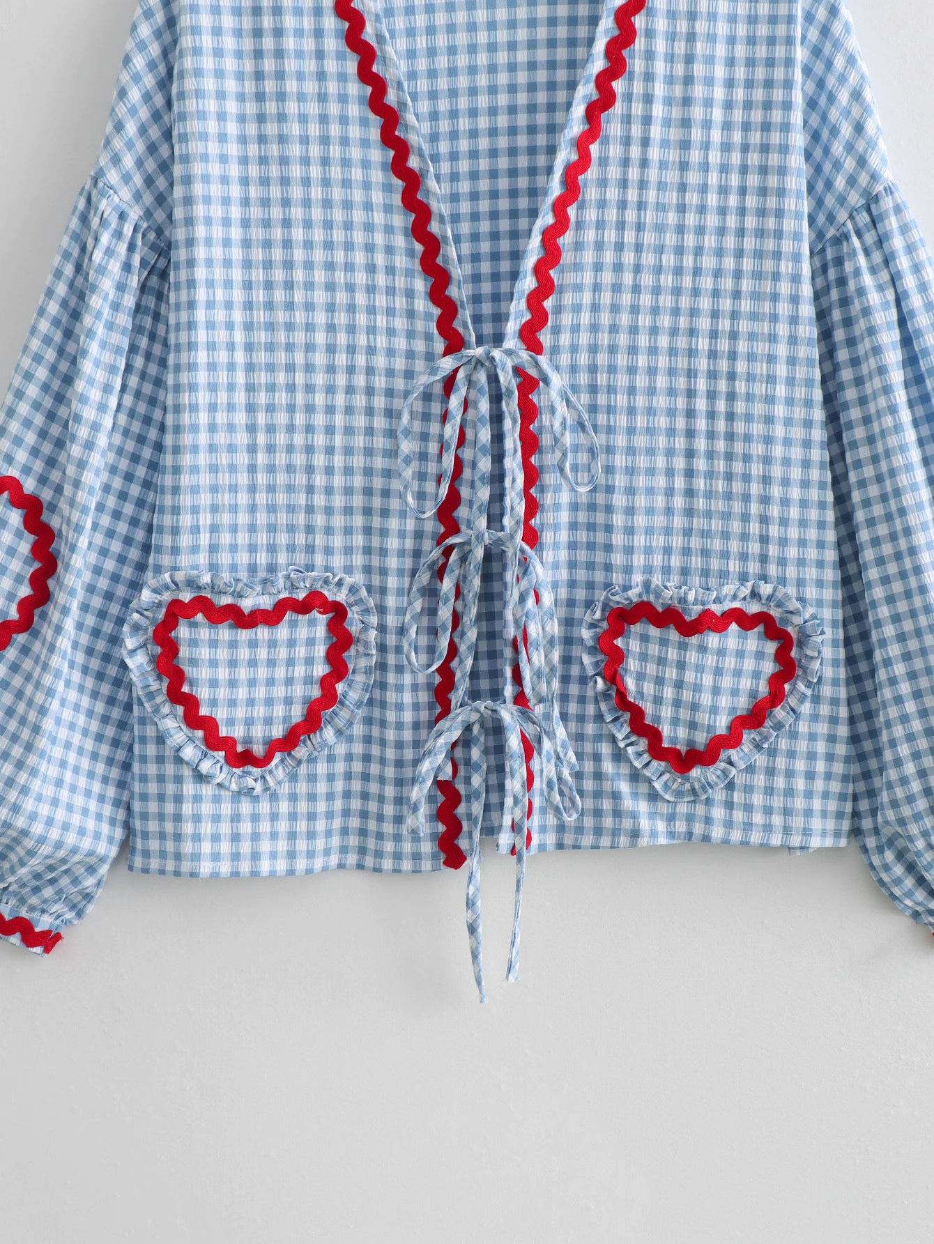 Orchid Moda gingham heart print top with blue and white checkered pattern and red trim accents
