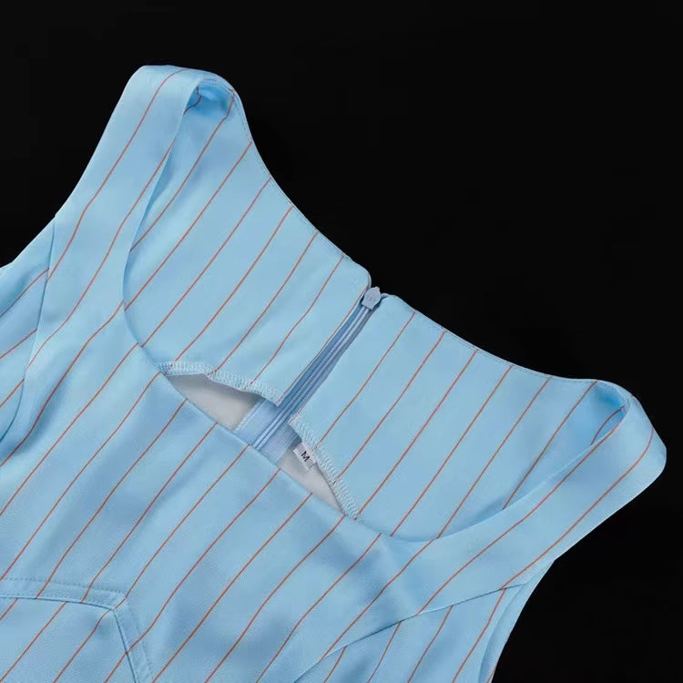 Close-up of blue blazer skirt set by Orchid Moda showing light blue fabric with thin stripes and zipper detail