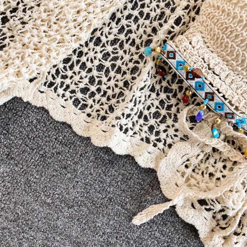Orchid Moda crochet beachwear set in cream with detailed scalloped edges and beaded embellishments