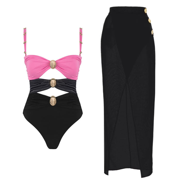 Orchid Moda pink and black one-piece swimsuit paired with black high-waisted wrap skirt fashionable summer bikinis