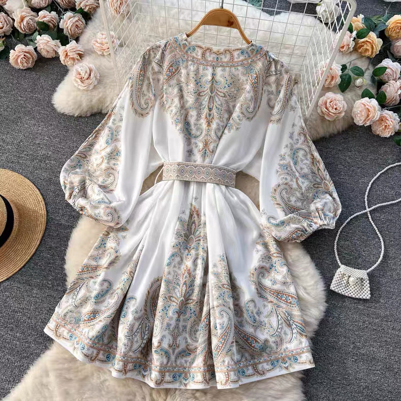 White floral paisley mini dress with long puff sleeves and detailed belt by Orchid Moda