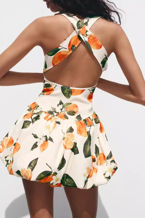 Orchid Moda floral printed sundress with open back and orange fruit design on white fabric