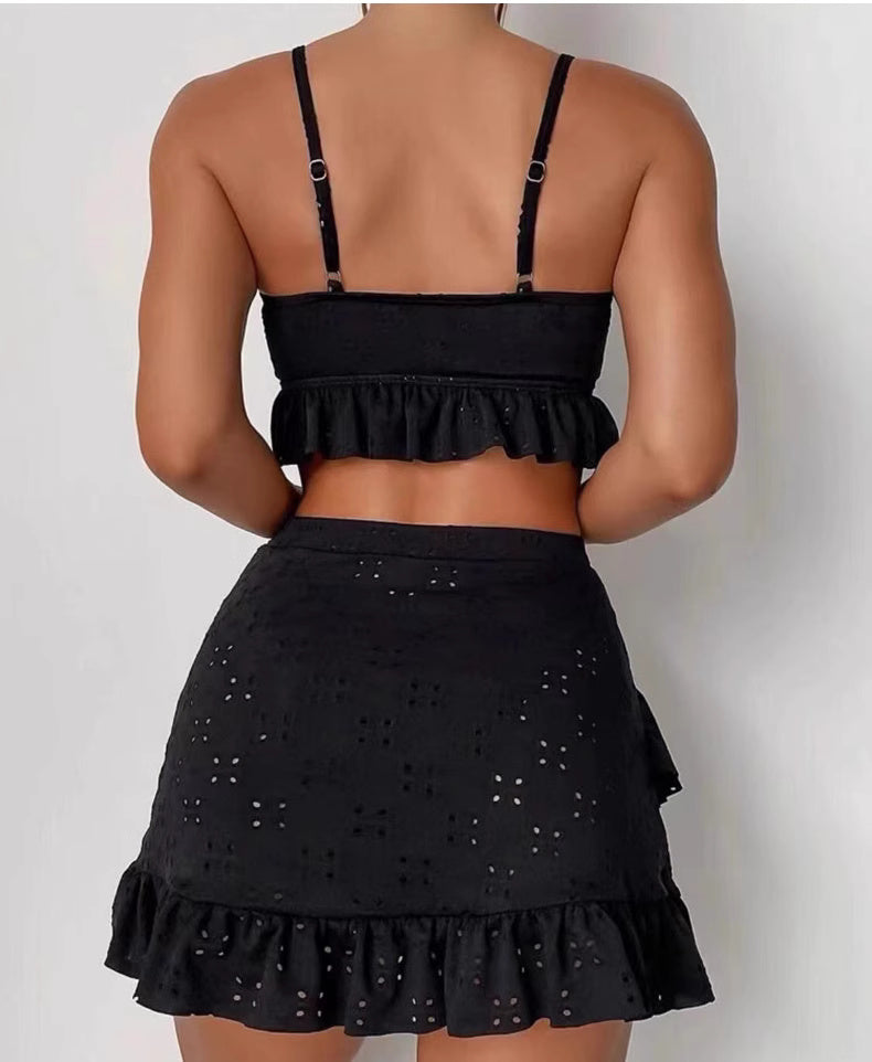 Back view of black knot front swimwear set with adjustable straps and ruffled hem by Orchid Moda