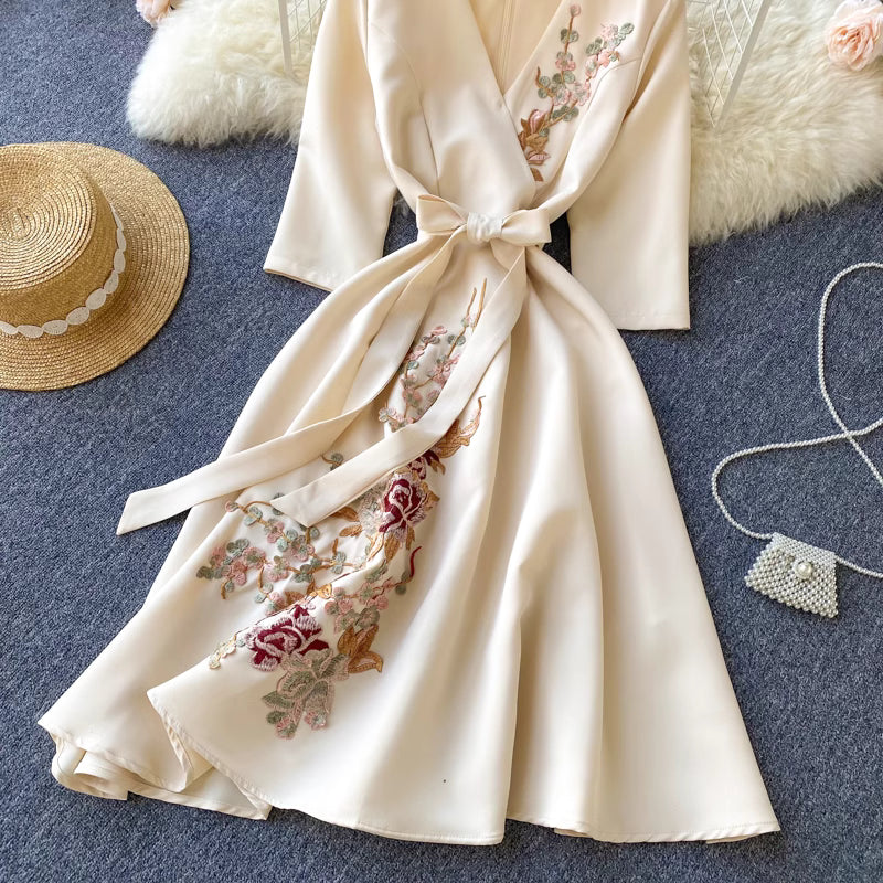 Orchid Moda almondine midi dress in cream with floral embroidery and waist tie belt