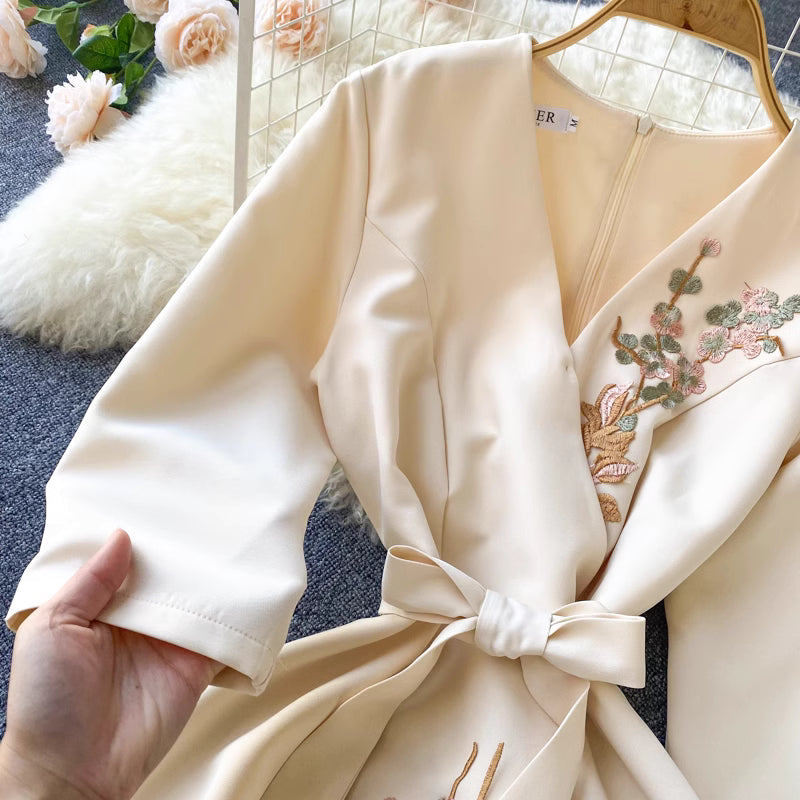 Orchid Moda almondine midi dress in cream with floral embroidery and waist tie detail