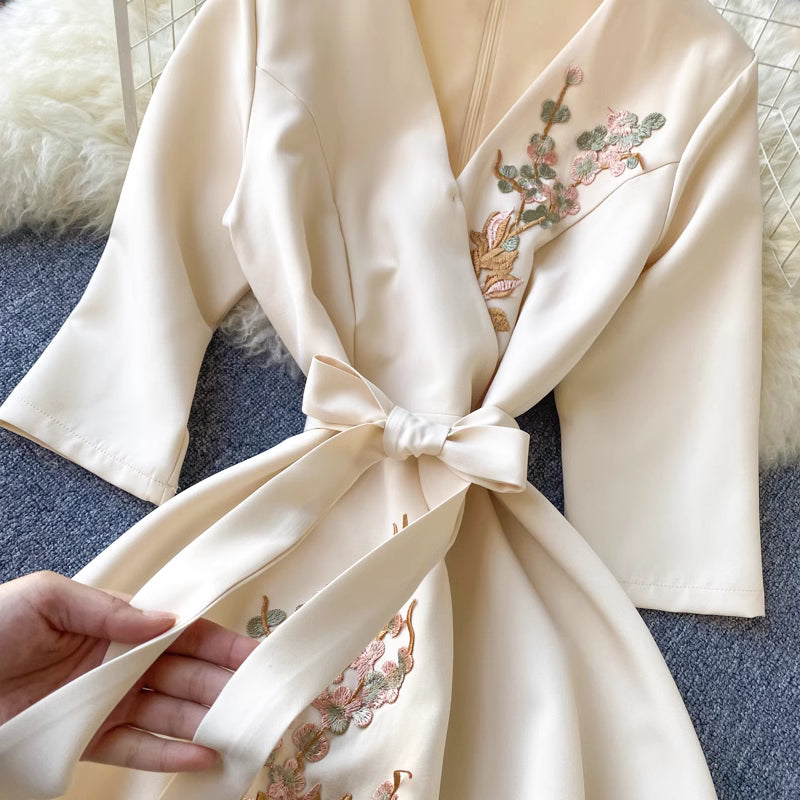 Orchid Moda almondine midi dress cream color with floral embroidery and waist tie detail