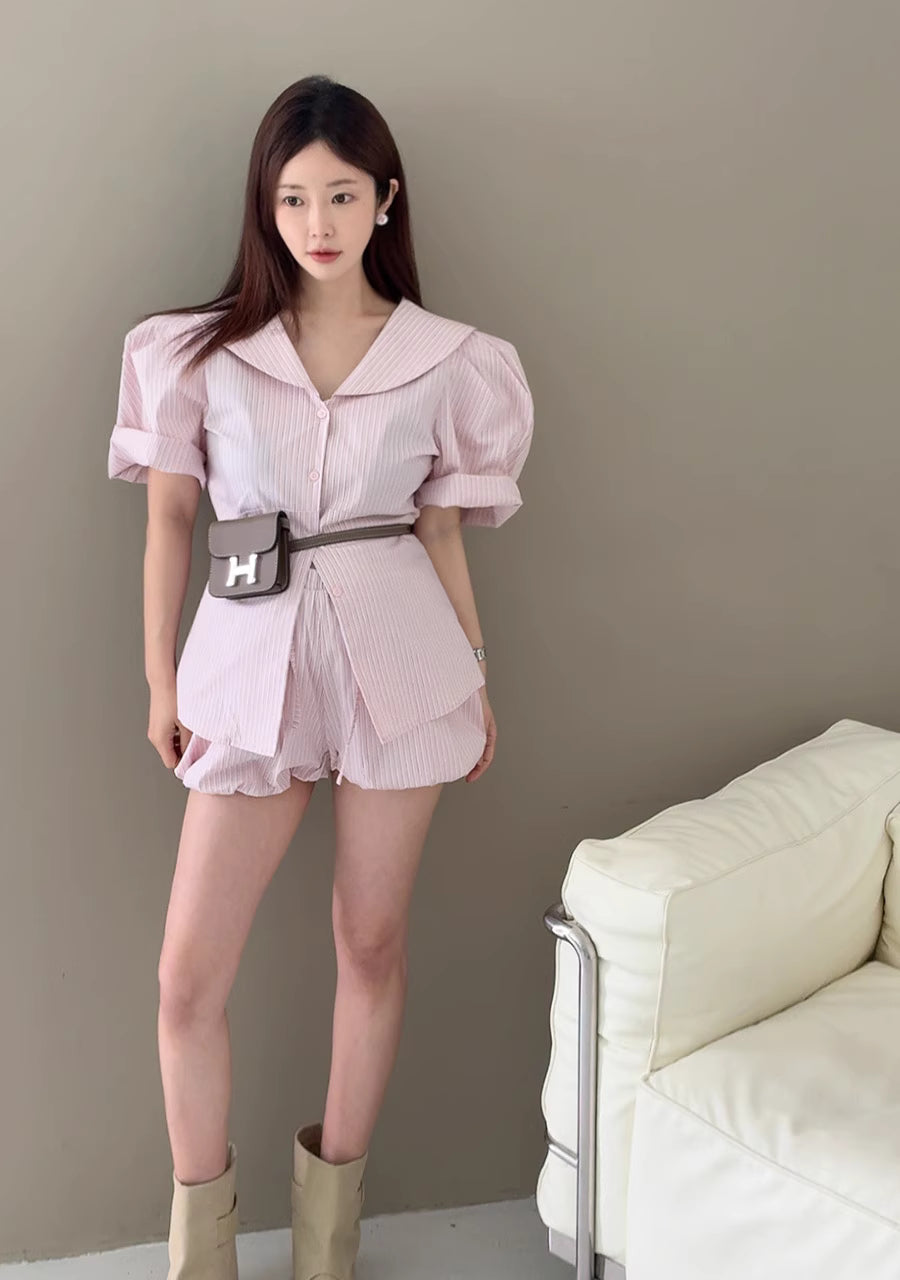 Orchid Moda pink puff sleeve short set with a collar and matching shorts styled with a belt bag and boots