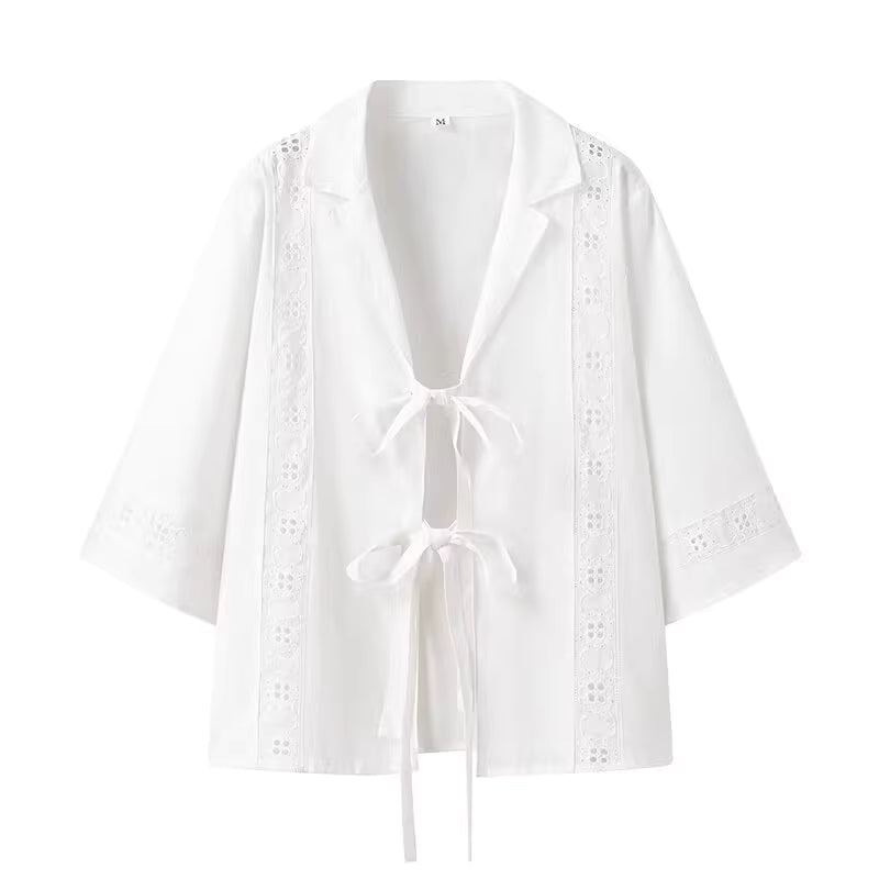 White lightweight blouse with tie closures and lace detailing, part of a summer co ord set for women