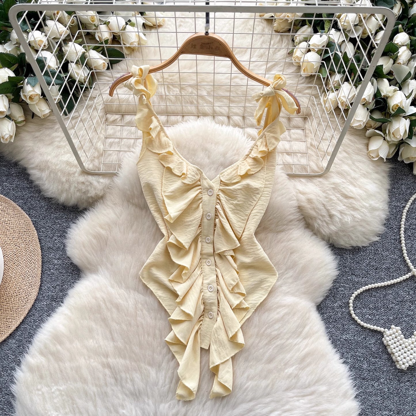 Orchid Moda light yellow ruffled cami top for women with button front and tie straps