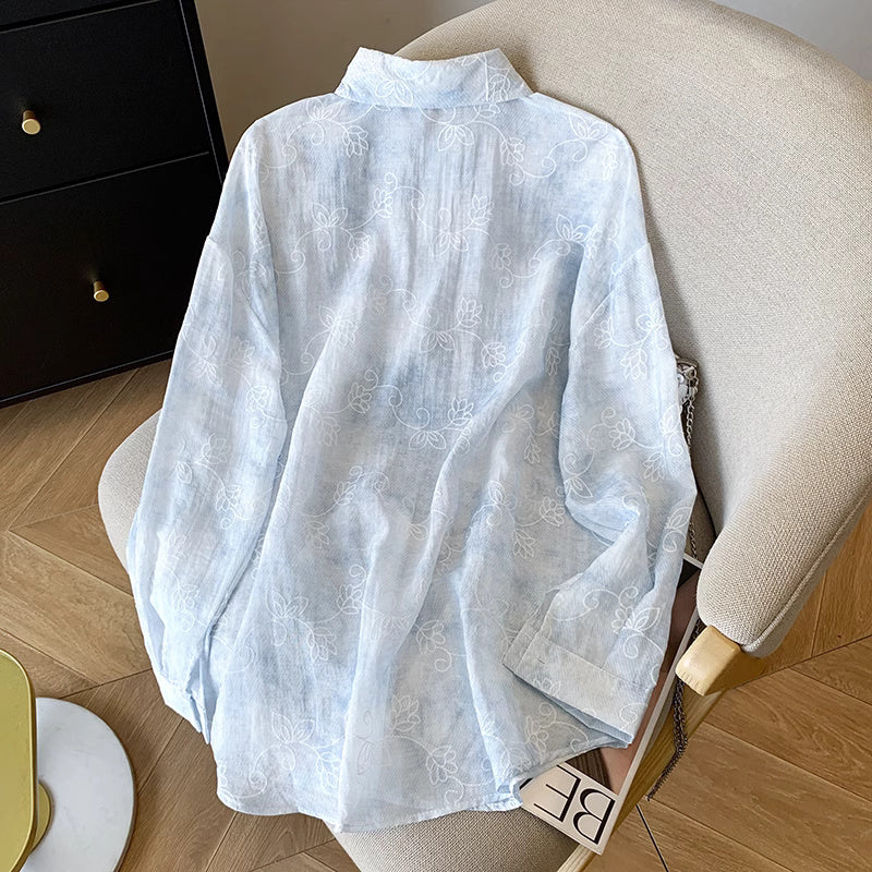 Light blue floral pattern summer co-ord suit for women shirt laid out on beige chair