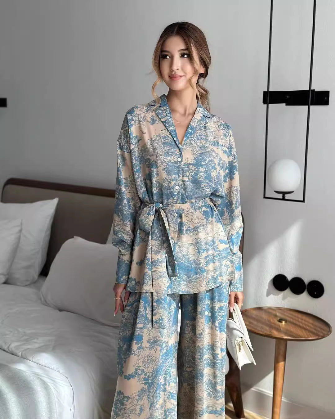 Orchid Moda women's co ord set featuring a blue and beige patterned long sleeve top and wide-leg pants