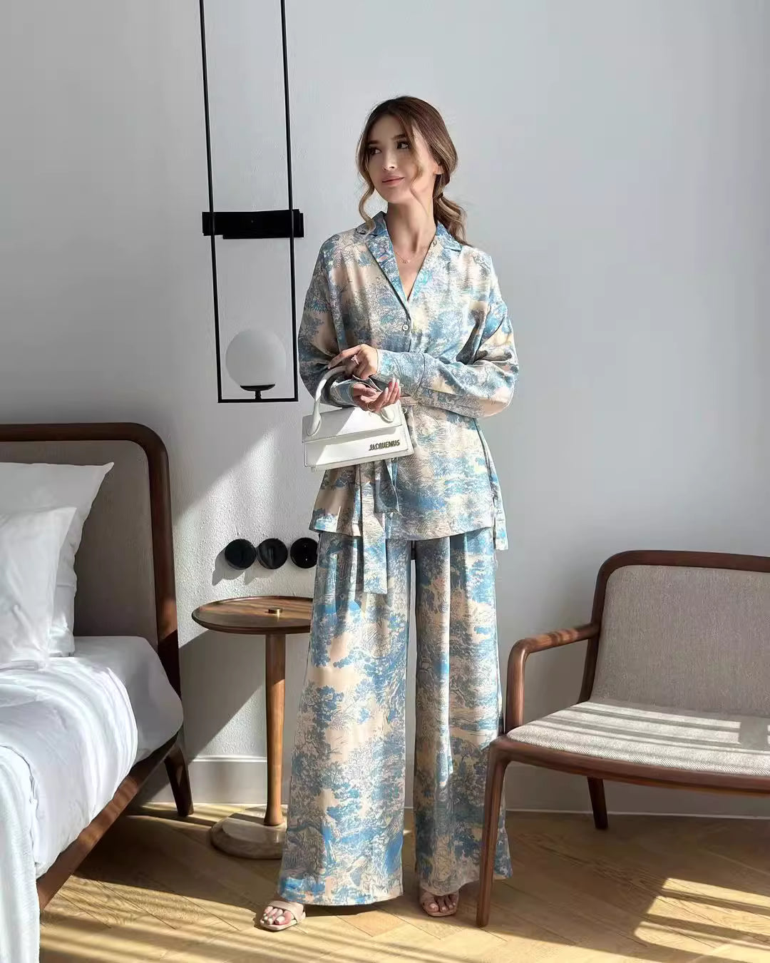 Orchid Moda women's co ord set featuring a long sleeve button-up top and wide-leg pants in blue and beige pattern