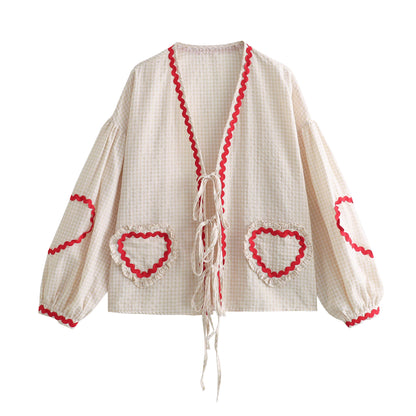 Orchid Moda gingham heart print top with red trim and tie closure on cream background