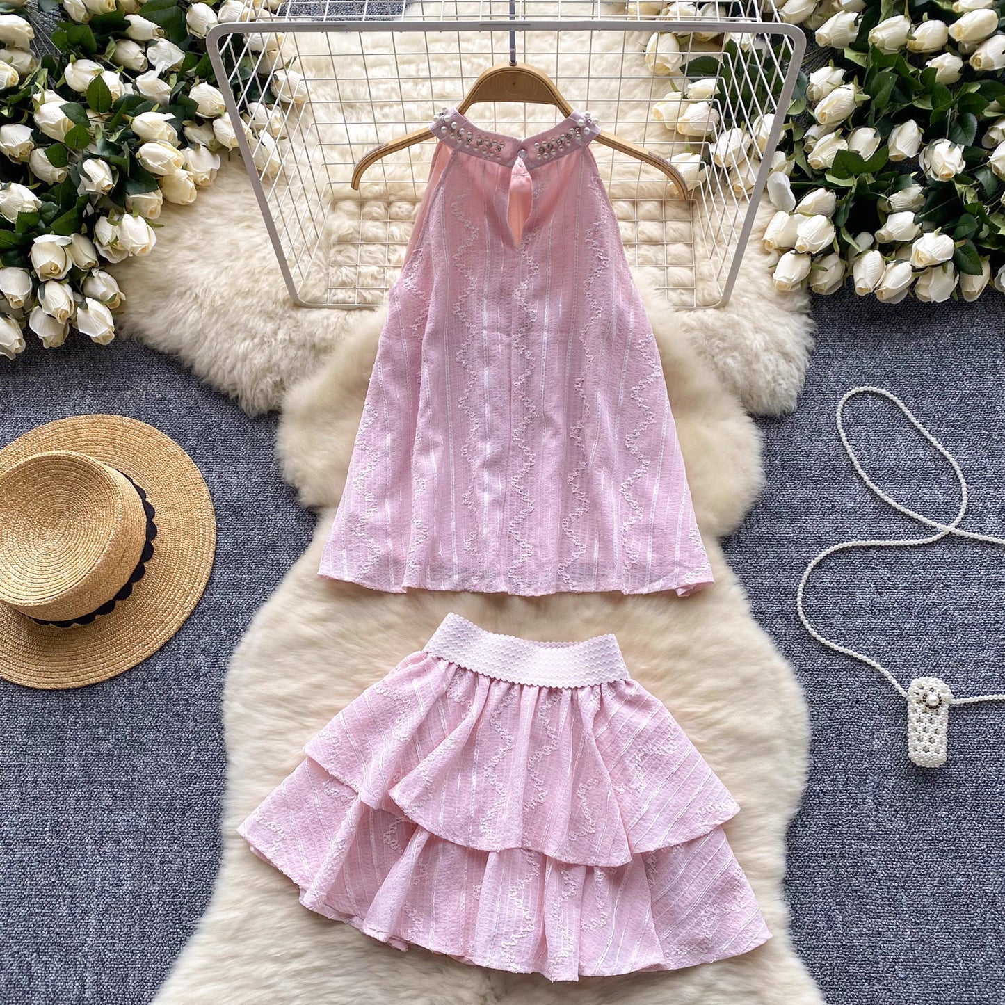 Pink beaded co ord set for women with halter neck top and tiered ruffle skirt by Orchid Moda