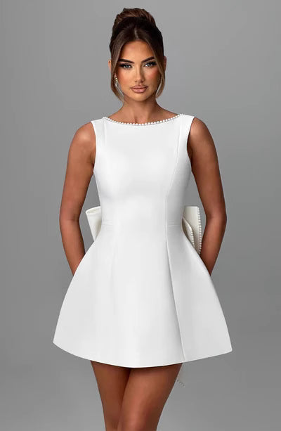 Bellara cocktail party dress by Orchid Moda in white sleeveless fit and flare style with pearl neckline