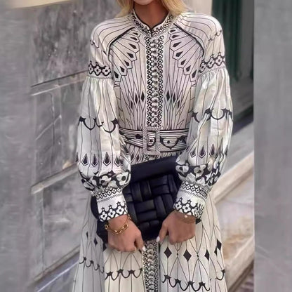 Orchid Moda bohemian midi dress in white with black geometric patterns and puffed long sleeves