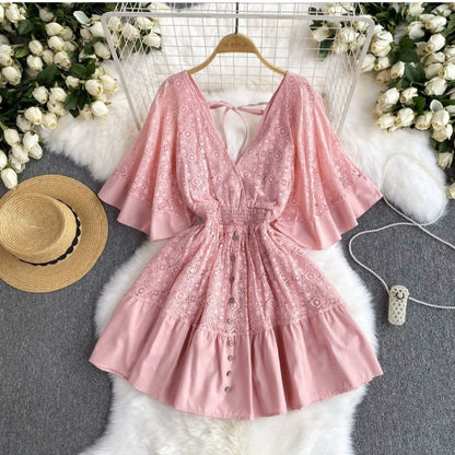 Pink Orchid Moda boho chic summer dress with lace details and button front on hanger