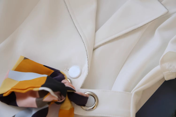 Orchid Moda chic cold shoulder blazer dress in white featuring colorful patterned sleeve detail