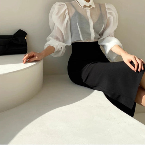 Orchid Moda chic sheer office blouse with puff sleeves paired with black fitted skirt