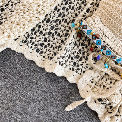 Orchid Moda crochet beachwear set in cream with detailed scalloped edges and beaded embellishments