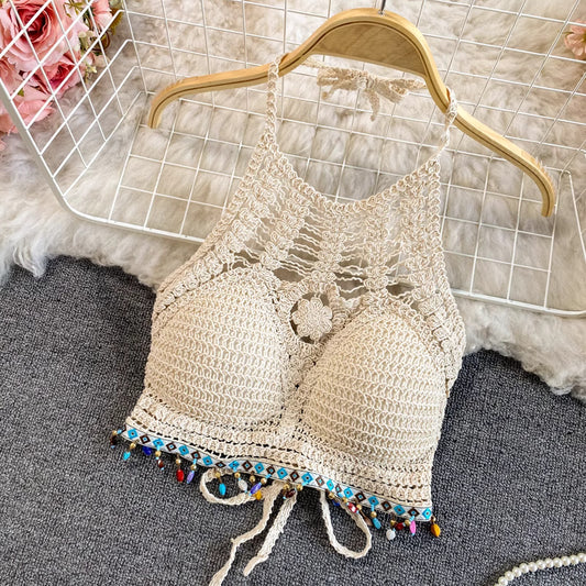 Orchid Moda beige crochet beachwear set top with colorful beaded trim and halter neckline on wooden hanger