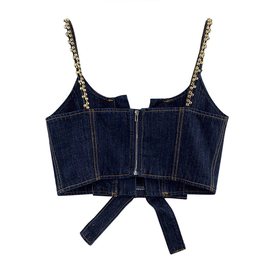Denim cami top with rhinestones featuring a front zipper and decorative straps by Orchid Moda