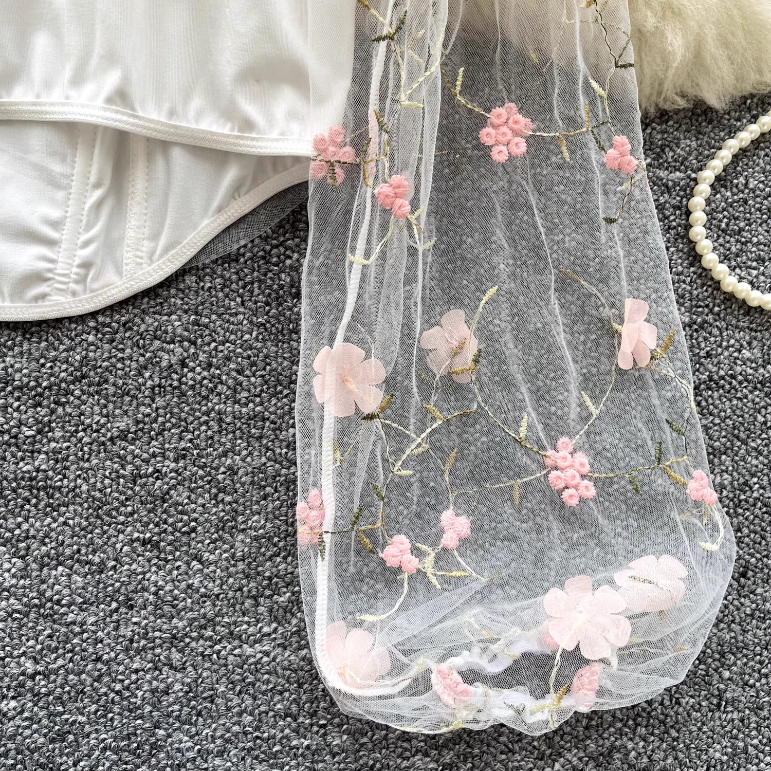 Orchid Moda enchanted sheer floral mesh top with delicate pink flower embroidery on transparent fabric