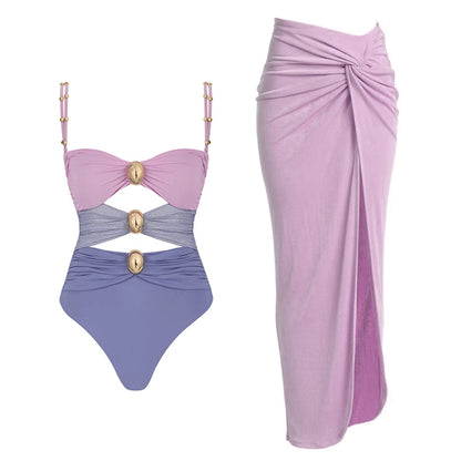 Orchid Moda fashionable summer bikinis one-piece swimsuit in purple and pink with gold accents and matching lilac sarong skirt