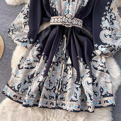 Orchid Moda floral paisley mini dress with long sleeves and matching belt in black and pastel colors