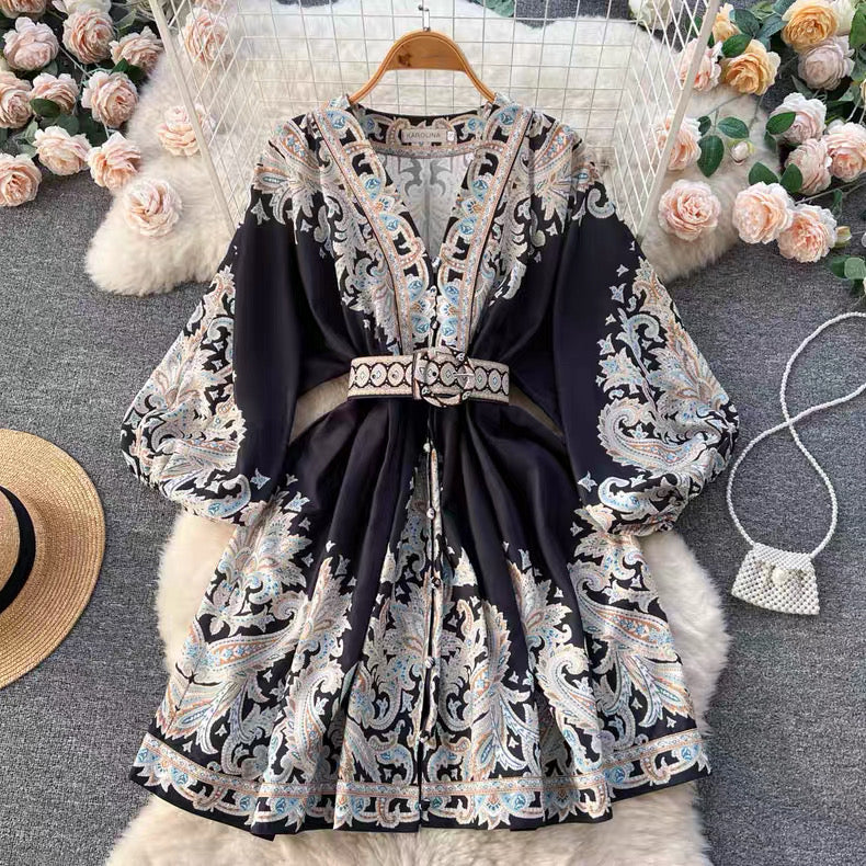 Orchid Moda floral paisley mini dress with long sleeves and matching belt on hanger
