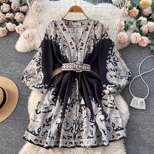Orchid Moda floral paisley mini dress with long sleeves and matching belt on hanger