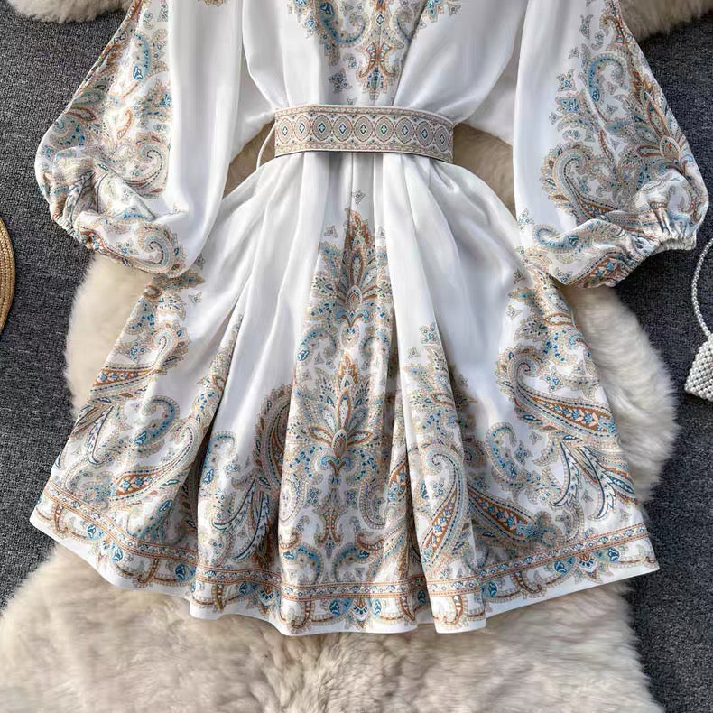 Orchid Moda floral paisley mini dress with long puff sleeves and a matching belt in soft white fabric