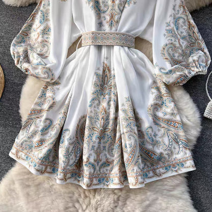 Orchid Moda floral paisley mini dress with long puff sleeves and a matching belt in soft white fabric