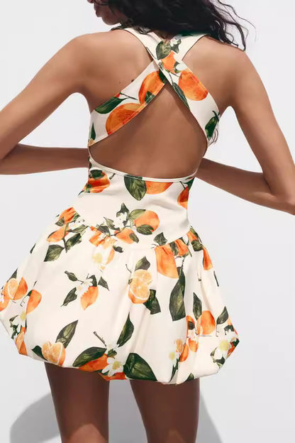 Orchid Moda floral printed sundress with open back and orange fruit design on white fabric