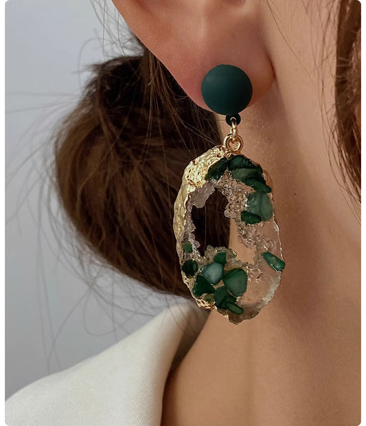 Orchid Moda trendy stone earrings for women with green stones and gold-tone accents on ear