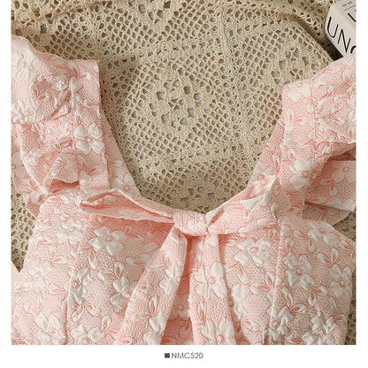 Pink floral jacquard crop top for women with textured fabric and ruffle details by Orchid Moda