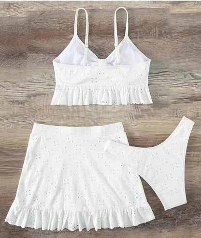 Orchid Moda white knot front swimwear set with ruffle details including top skirt and bottoms