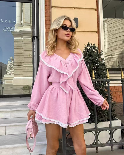 Orchid Moda pink flare shorts and top set with ruffle details worn with sunglasses and pink handbag