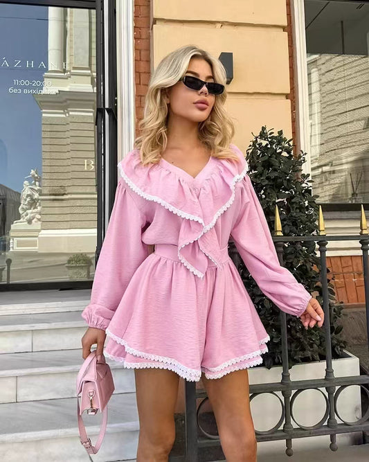 Orchid Moda pink flare shorts and top set with ruffle details worn with sunglasses and pink handbag