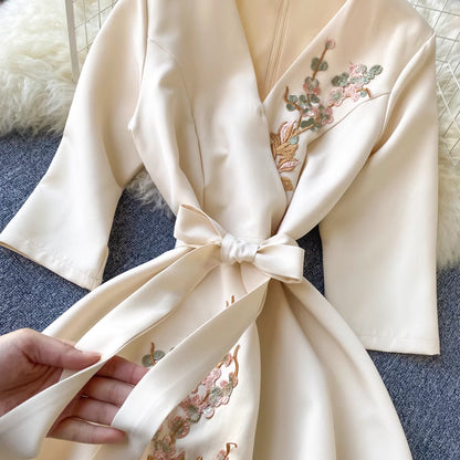 Orchid Moda almondine midi dress cream color with floral embroidery and waist tie detail