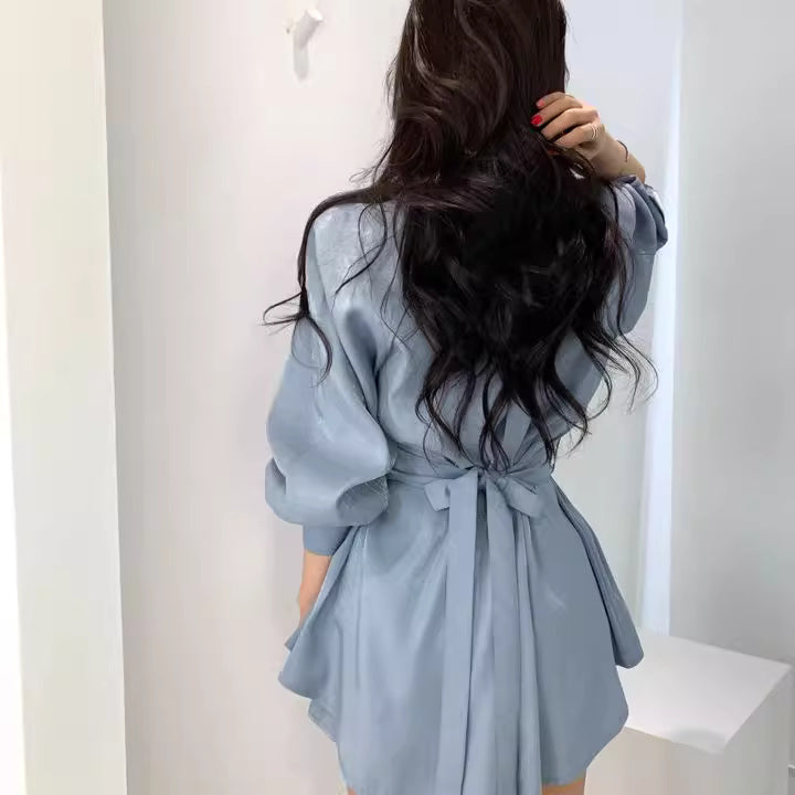 Orchid Moda light blue retro co-ord set with puff sleeves and waist tie seen from back