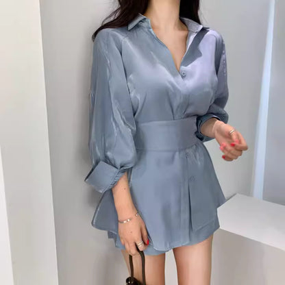 Orchid Moda stylish blue satin retro co-ord set with long sleeves and a high waist belt