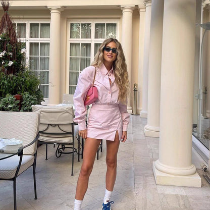 Woman wearing Orchid Moda rosebud co ord set online pink striped shirt and skirt with sunglasses and pink purse