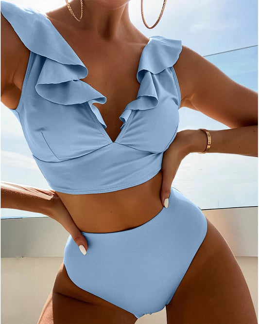Orchid Moda light blue ruffled neck swimsuit with high-waist bottoms and layered ruffle details
