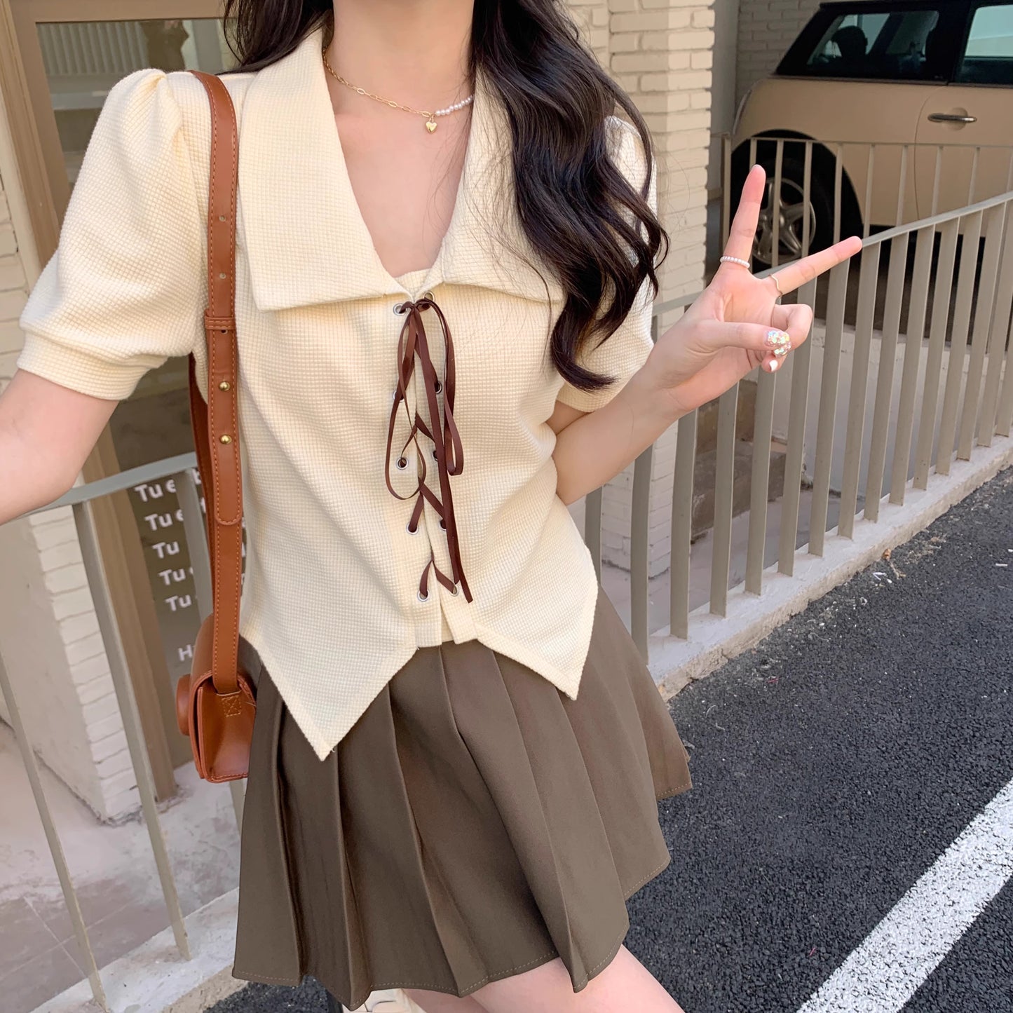 Orchid Moda short sleeve statement shirt in cream with brown tie details and puff sleeves