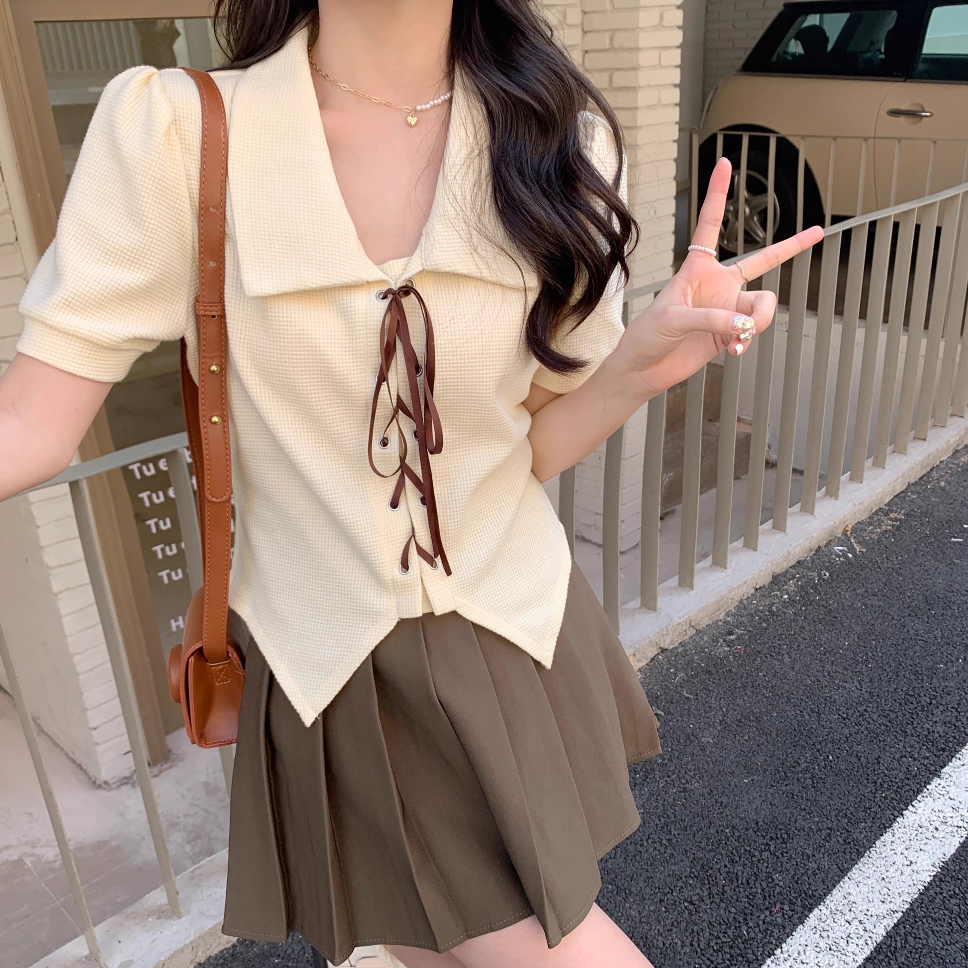 Orchid Moda short sleeve statement shirt in cream with brown tie details and puff sleeves