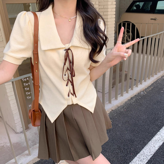 Orchid Moda short sleeve statement shirt in cream with brown tie details and puff sleeves
