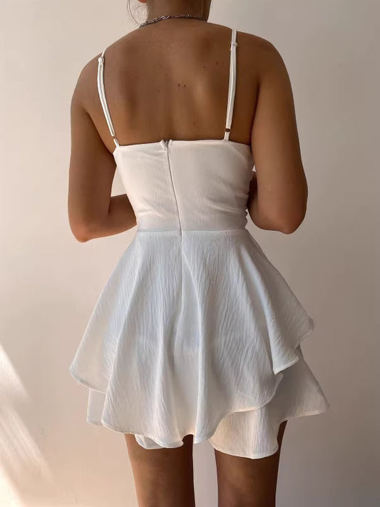 Woman wearing white solid culottes summer outfit with layered design and adjustable straps back view