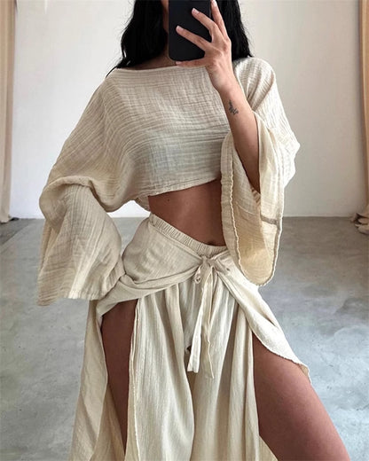 Orchid Moda beige split hem pants outfit for women with flowy wide sleeves and side slits