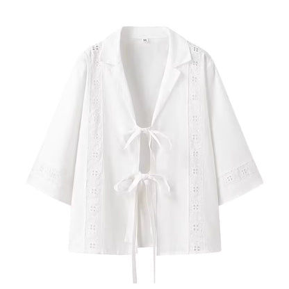 White lightweight blouse with tie closures and lace detailing, part of a summer co ord set for women